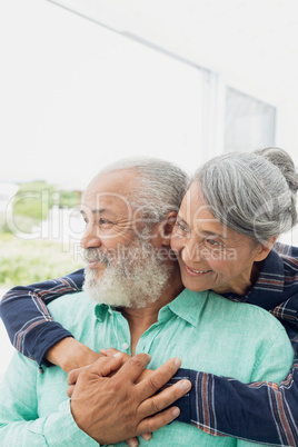 Couple smiling inside a room