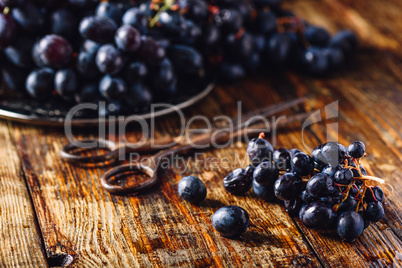 Blue Vine Grapes on wooden surface