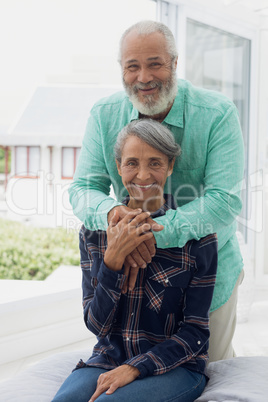 Couple smiling inside a room