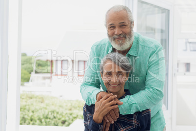 Couple smiling inside room