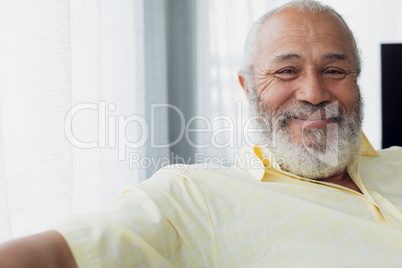 Man smiling inside a room