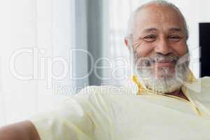 Man smiling inside a room