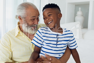 Grandfather and grandson smiling