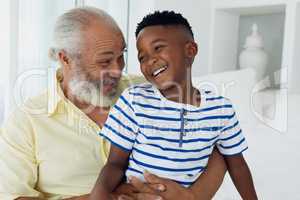 Grandfather and grandson smiling