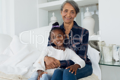 Grandmother and granddaughter smiling