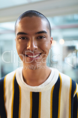Male graphic designer smiling in office
