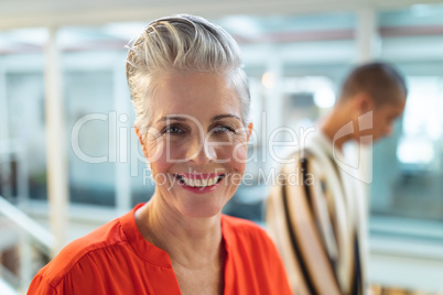 Female graphic designers smiling in office