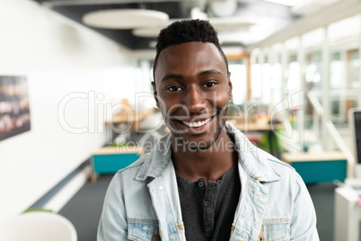 Male graphic designer smiling in office