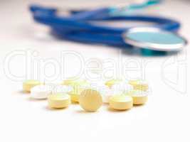 White and yellow pills on a table