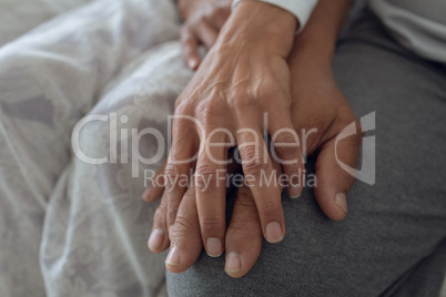 Couple hands on top of each other