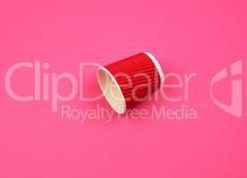red paper cup with corrugated edges for hot drinks