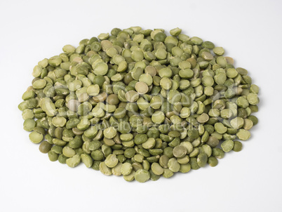 Green dry peas in a pile isolated on a white background.