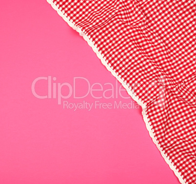 white red checkered kitchen towel on a pink background