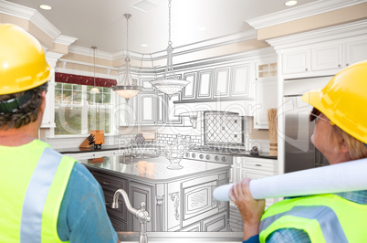 Male and Female Contractors Overlooking Kitchen Drawing