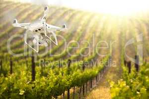Unmanned Aircraft System (UAV) Quadcopter Drone In The Air Over