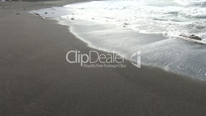 Ocean waves and beach with black volcanic sand, Canary Islands, Fuerteventura, Spain