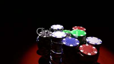 Close up of casino chips on red table surface