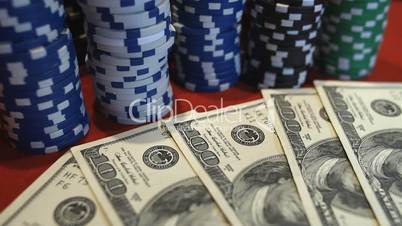 Red dice falling on money, gambler playing game at casino, addiction to gambling