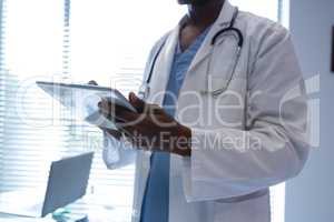 Male doctor using digital tablet in the hospital