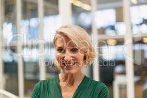 Businesswoman standing in the corridor at office