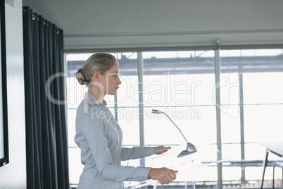 Businesswoman practicing her speech in the conference room