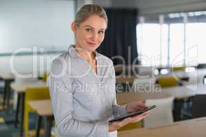 Businesswoman using digital tablet in the conference room at office
