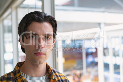 Male executive standing in the conference room at office