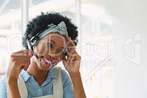 Female customer service executive talking on headset in office