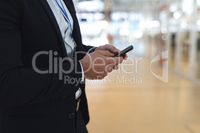 Businessman using mobile phone in a modern office