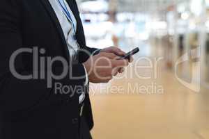 Businessman using mobile phone in a modern office