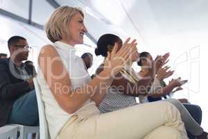 Audience applauding in a business seminar