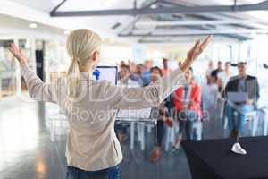 Female speaker speaks in a business seminar