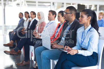 Audience listening to speaker in a business seminar