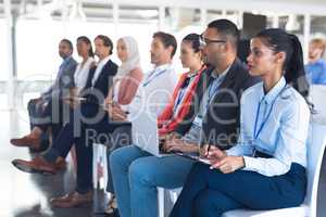 Audience listening to speaker in a business seminar