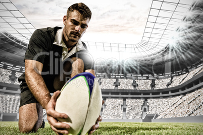 Composite image of caucasian male rugby player on field