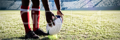 Composite image of multi-ethnic rugby players on field