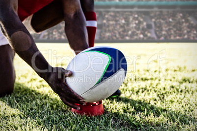 Composite image of mixed-race rugby player on field