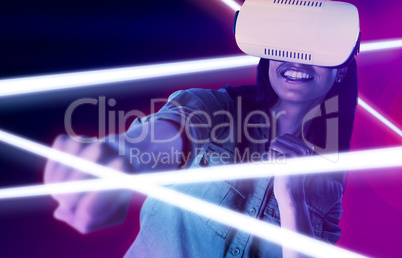 Composite image of woman gesturing while using virtual reality headset