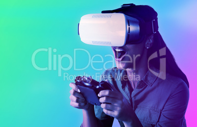 Composite image of woman playing video game with virtual reality headset