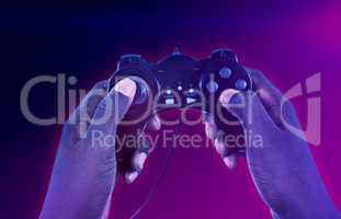 Composite image of hand of man playing video game against white background