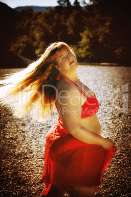 Attractive overweight woman in stylish red outfit