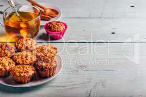 Oatmeal muffins with cup of green tea.