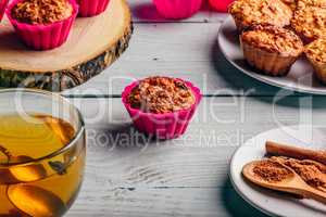 Oatmeal muffins with cup of green tea.