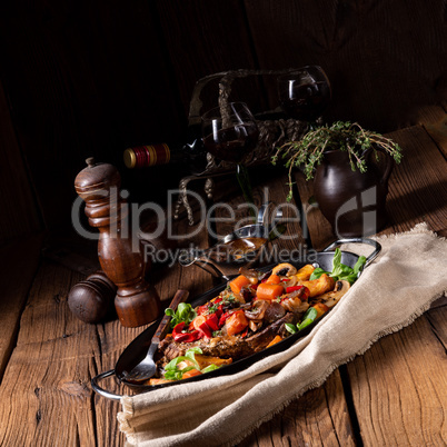 tender beef topped with various vegetables