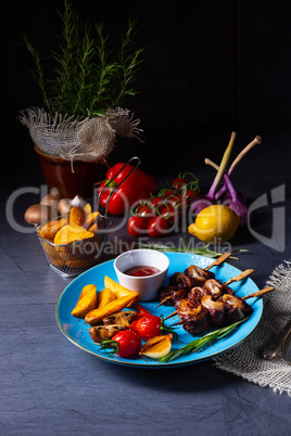 cattle shashlik skewers with grilled vegetables on a caucasian