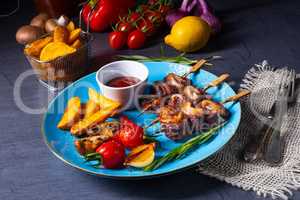 cattle shashlik skewers with grilled vegetables on a caucasian