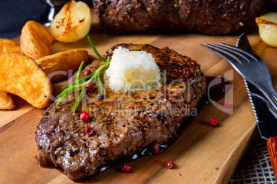 Butter Beef Steak with herbs and potato wedges