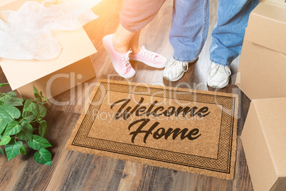 Man and Woman Unpacking Near Welcome Home Welcome Mat, Moving Bo