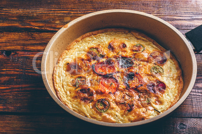 Frittata with chorizo, tomatoes and chili peppers.