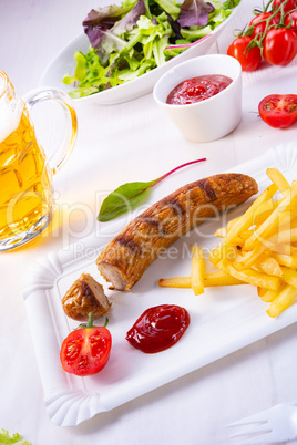 delicious bratwurst with rolls and beer